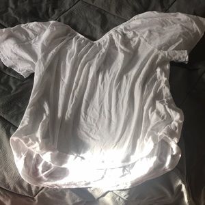 WHITE TOP WITH LACED UP BACK.